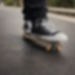Converse low-cut black shoes on a skateboard