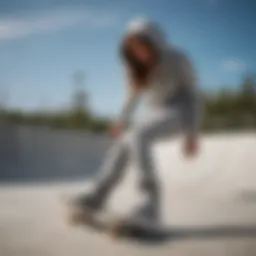 A stylish grey hoodie paired with skate shoes on a half-pipe