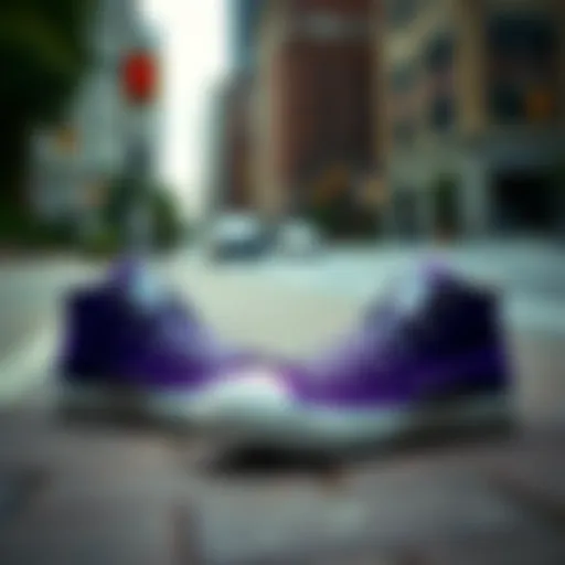 A pair of vibrant purple Converse shoes on a city sidewalk.