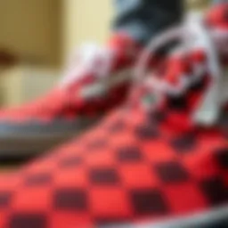 Close-up view of red and black checker Vans highlighting the unique pattern
