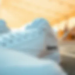 Close-up view of all white Reebok Classics showcasing their design details
