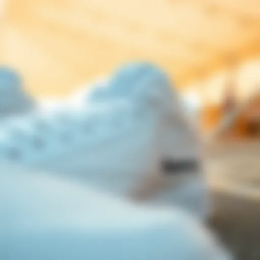Close-up view of all white Reebok Classics showcasing their design details