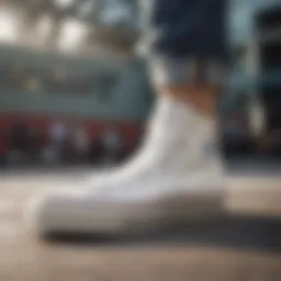 Close-up view of white Converse platform sneakers on a skateboard