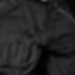 Close-up of American Stitch black cargo pants showcasing unique stitching and pockets