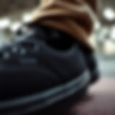 Detail View of Black Vans Design Features Close-up of black Vans shoes showcasing the texture and design elements.